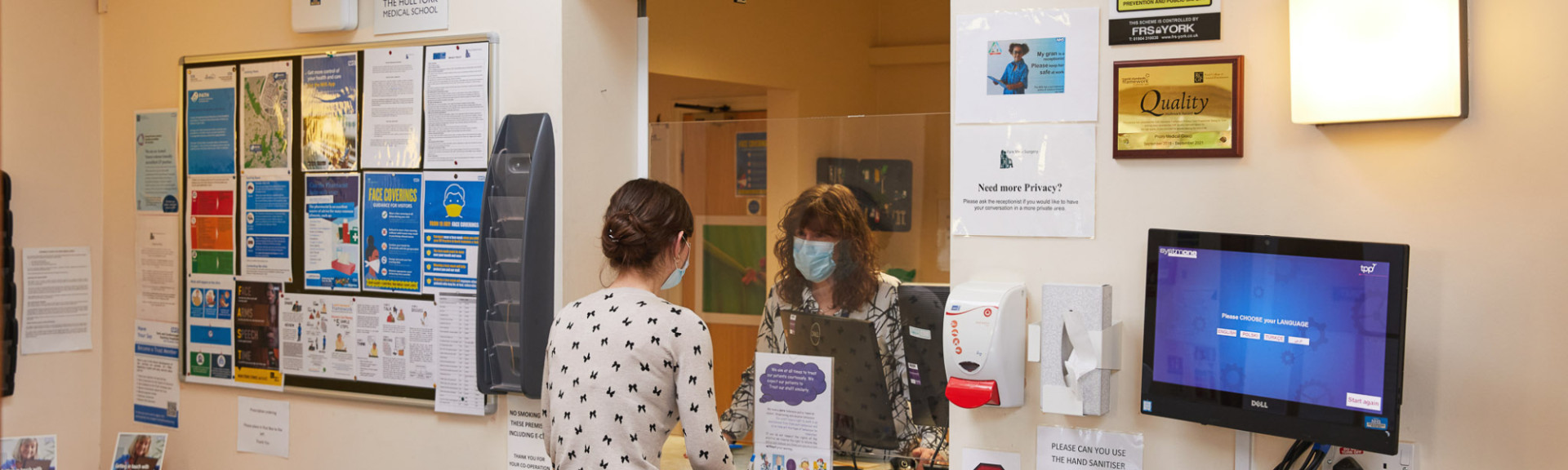 A photo showing a patient at the reception desk at Park View surgery