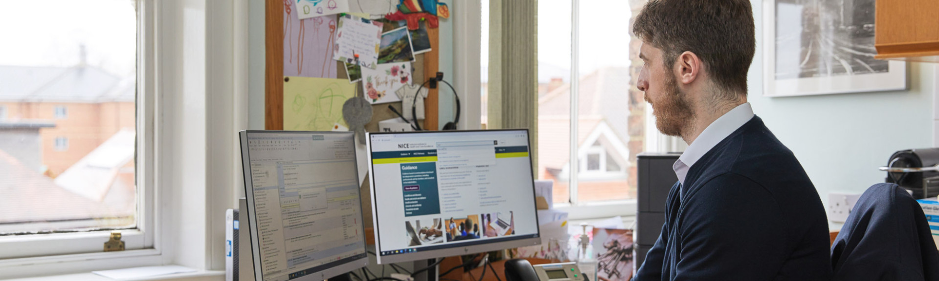 A photo showing a pharmacist using a computer