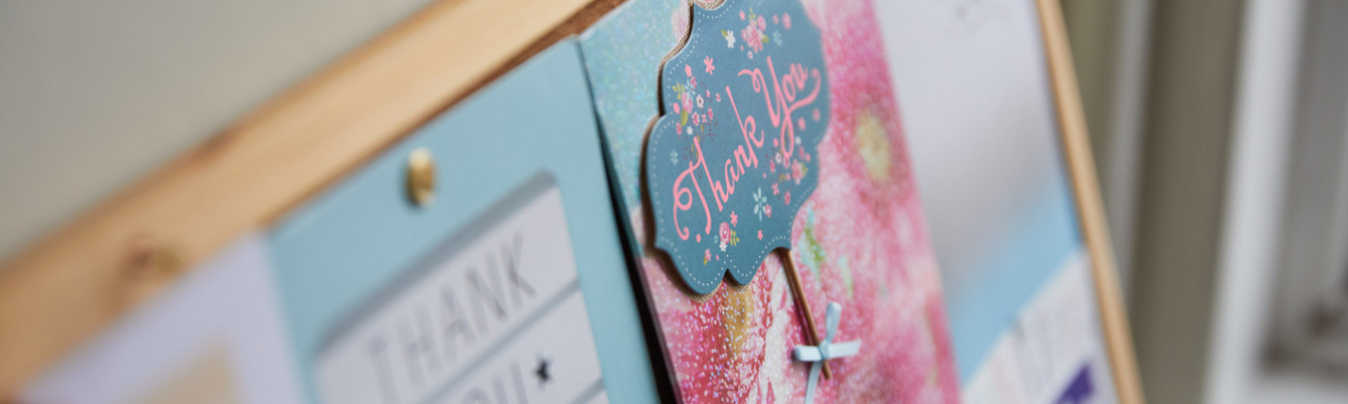 A photo showing a pin board full of thankyou cards