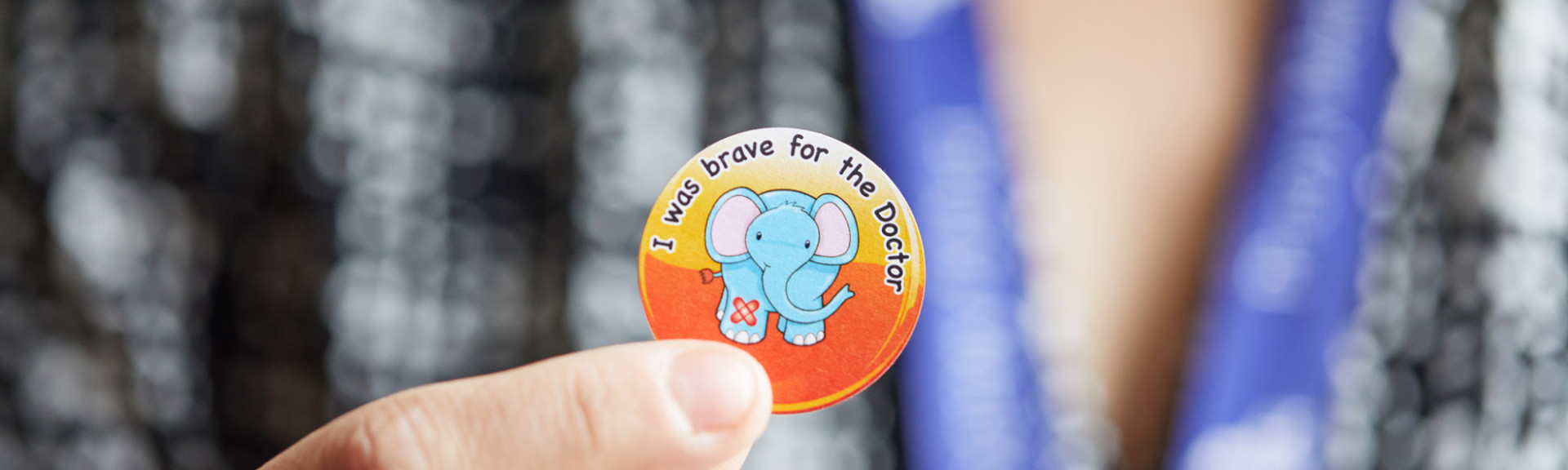 A photo showing an “I was brave for the doctor” sticker