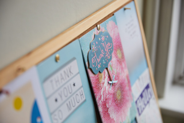 A photo showing a pin board full of thankyou cards